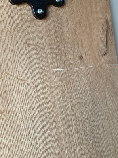 TableKarrier - Dents in the panel and scratch on the back side of the table
